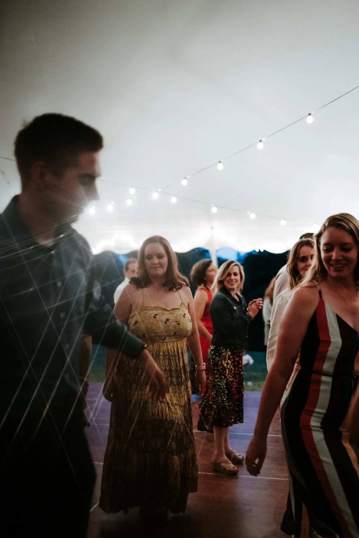 Guests dancing at dusk