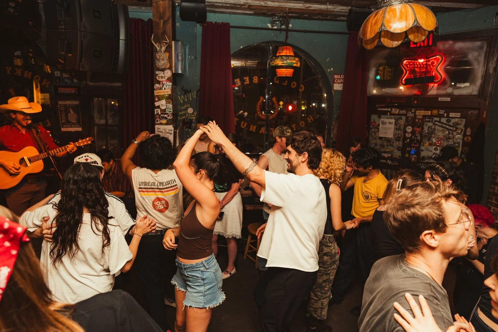 A packed honky tonk dance floor