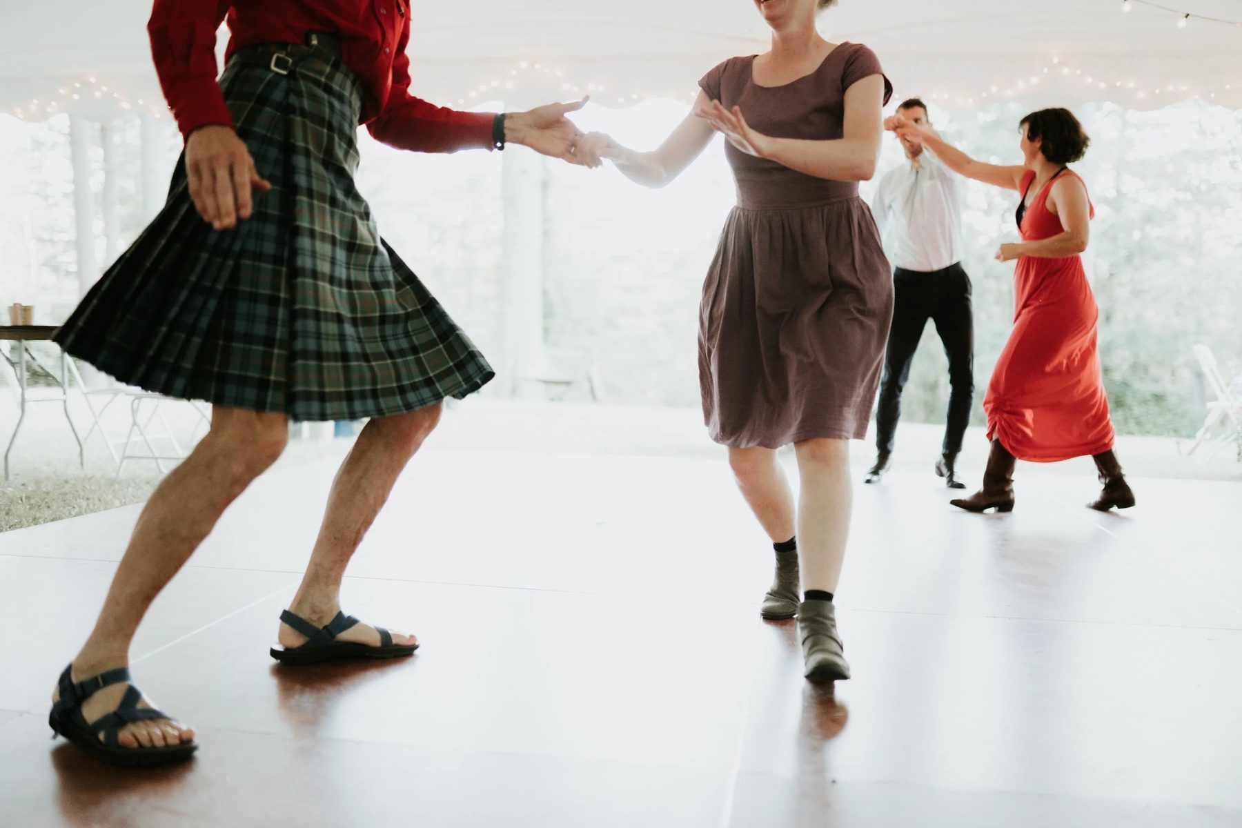 Guests dancing on a white floor